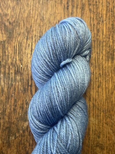 Blue Colorway: Dark Indigo. Length: 437 yds / 400 meters. 100 G Introducing Indigo DK yarn, a naturally dyed blend of 75% Superwash Merino and 25% nylon. This Peru-origin yarn is hand-dyed using plant-based dyes, resulting in an eco-friendly option. Perfect for knitting or crocheting projects. Care Instructions: Hand wash in cold water with a gentle detergent made specifically for washing wool and other fine fibers, or a PH-neutral, dye free detergent. Lay flat to dry. Length: 437 yds / 400 meters. <strong>While our team hand-dyes each skein with the utmost care, natural dyes results can vary based on plant materials and fibers. Please be aware that variations in color and appearance may vary from the display image.  </strong> <table width="472"> <tbody> <tr> <td><strong>Metric</strong></td> <td><strong>US Knitting Needle</strong></td> <td><strong>Crochet Hook</strong></td> </tr> <tr> <td style="font-style: inherit; font-weight: inherit;">3.25 mm</td> <td style="font-style: inherit; font-weight: inherit;">US 1-2</td> <td style="font-style: inherit; font-weight: inherit;">D3</td> </tr> </tbody> </table>   <table width="472"> <tbody> <tr> <td><strong>Stitches per Inch</strong></td> </tr> <tr> <td style="font-style: inherit; font-weight: inherit;">30 st/4″ or 7-8 st/1″</td> </tr> </tbody> </table>