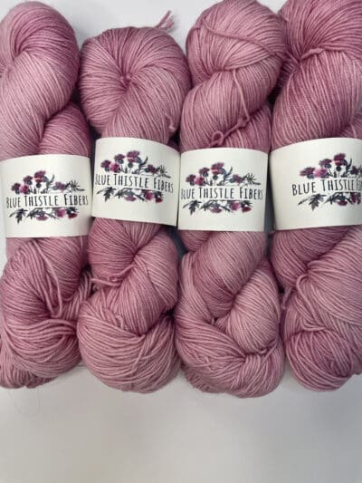 Colorway: Hibiscus.  Length: 437 yds / 400 meters. 100 Grams. Our Variegated Hibiscus sock 4-ply  yarn is a naturally dyed variation in our pink colorway. Sock yarn Made from 75% Superwash Merino Wool and 25% Recycled Nylon, this 4-ply yarn from Peru is strong and light. Perfect for everyday garment projects. Machine washable and easy to care for. Care Instructions: Machine wash on a gentle cycle using mild detergent. Do not bleach. Dry flat away from direct sunlight. <strong>While our team hand-dyes each skein with the utmost care, natural dyes results can vary based on plant materials and fibers. Please be aware that variations in color and appearance may vary from the display image. </strong> <table width="472"> <tbody> <tr> <td><strong>Metric</strong></td> <td><strong>US Knitting Needle</strong></td> <td><strong>Crochet Hook</strong></td> </tr> <tr> <td style="font-style: inherit; font-weight: inherit;">3.25 mm</td> <td style="font-style: inherit; font-weight: inherit;">US 1-2</td> <td style="font-style: inherit; font-weight: inherit;">D3</td> </tr> </tbody> </table>   <table width="472"> <tbody> <tr> <td><strong>Stitches per Inch</strong></td> </tr> <tr> <td style="font-style: inherit; font-weight: inherit;">30 st/4″ or 7-8 st/1″</td> </tr> </tbody> </table>  