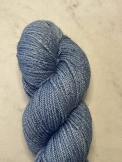 Blue Colorway: Dark Indigo. Length: 437 yds / 400 meters. 100 G Introducing Indigo DK yarn, a naturally dyed blend of 75% Superwash Merino and 25% nylon. This Peru-origin yarn is hand-dyed using plant-based dyes, resulting in an eco-friendly option. Perfect for knitting or crocheting projects. Care Instructions: Hand wash in cold water with a gentle detergent made specifically for washing wool and other fine fibers, or a PH-neutral, dye free detergent. Lay flat to dry. Length: 437 yds / 400 meters. <strong>While our team hand-dyes each skein with the utmost care, natural dyes results can vary based on plant materials and fibers. Please be aware that variations in color and appearance may vary from the display image.  </strong> <table width="472"> <tbody> <tr> <td><strong>Metric</strong></td> <td><strong>US Knitting Needle</strong></td> <td><strong>Crochet Hook</strong></td> </tr> <tr> <td style="font-style: inherit; font-weight: inherit;">3.25 mm</td> <td style="font-style: inherit; font-weight: inherit;">US 1-2</td> <td style="font-style: inherit; font-weight: inherit;">D3</td> </tr> </tbody> </table>   <table width="472"> <tbody> <tr> <td><strong>Stitches per Inch</strong></td> </tr> <tr> <td style="font-style: inherit; font-weight: inherit;">30 st/4″ or 7-8 st/1″</td> </tr> </tbody> </table>