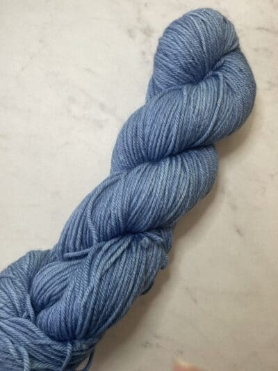 Blue Colorway: Dark Indigo. Length: 437 yds / 400 meters. 100 G Introducing Indigo DK yarn, a naturally dyed blend of 75% Superwash Merino and 25% nylon. This Peru-origin yarn is hand-dyed using plant-based dyes, resulting in an eco-friendly option. Perfect for knitting or crocheting projects. Care Instructions: Hand wash in cold water with a gentle detergent made specifically for washing wool and other fine fibers, or a PH-neutral, dye free detergent. Lay flat to dry. Length: 437 yds / 400 meters. <strong>While our team hand-dyes each skein with the utmost care, natural dyes results can vary based on plant materials and fibers. Please be aware that variations in color and appearance may vary from the display image.  </strong> <table width="472"> <tbody> <tr> <td><strong>Metric</strong></td> <td><strong>US Knitting Needle</strong></td> <td><strong>Crochet Hook</strong></td> </tr> <tr> <td style="font-style: inherit; font-weight: inherit;">3.25 mm</td> <td style="font-style: inherit; font-weight: inherit;">US 1-2</td> <td style="font-style: inherit; font-weight: inherit;">D3</td> </tr> </tbody> </table>   <table width="472"> <tbody> <tr> <td><strong>Stitches per Inch</strong></td> </tr> <tr> <td style="font-style: inherit; font-weight: inherit;">30 st/4″ or 7-8 st/1″</td> </tr> </tbody> </table>