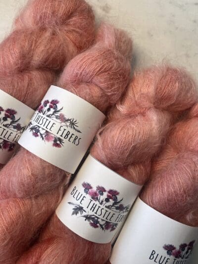 Orange Colorway: Light Orange Tulip. 437 yards/400 meters. 50 Grams. Light Orange Tulip Mohair is our 1-ply. made from 70% Super Kid Mohair, 30% Mulberry Silk, is silky soft and perfect for an entire sweater or to be threaded with one of our wool yarns.