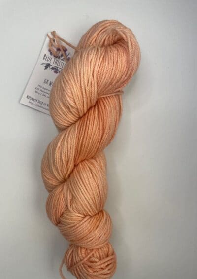 Orange Colorway: Variegated Pumpkin Spice. Length: 437 yds / 400 meters. 100 g Introducing Variegated Pumpkin Spice DK yarn, a naturally dyed variegated orange/cream blend of 75% Superwash Merino and 25% nylon. This Peru-origin yarn is hand-dyed using plant-based dyes, resulting in an eco-friendly option. Perfect for knitting or crocheting projects. Care Instructions: Hand wash in cold water with a gentle detergent made specifically for washing wool and other fine fibers, or a PH-neutral, dye free detergent. Lay flat to dry. Length: 437 yds / 400 meters. <strong>While our team hand-dyes each skein with the utmost care, natural dyes results can vary based on plant materials and fibers. Please be aware that variations in color and appearance may vary from the display image.  </strong> <table width="472"> <tbody> <tr> <td><strong>Metric</strong></td> <td><strong>US Knitting Needle</strong></td> <td><strong>Crochet Hook</strong></td> </tr> <tr> <td style="font-style: inherit; font-weight: inherit;">3.25 mm</td> <td style="font-style: inherit; font-weight: inherit;">US 1-2</td> <td style="font-style: inherit; font-weight: inherit;">D3</td> </tr> </tbody> </table>   <table width="472"> <tbody> <tr> <td><strong>Stitches per Inch</strong></td> </tr> <tr> <td style="font-style: inherit; font-weight: inherit;">30 st/4″ or 7-8 st/1″</td> </tr> </tbody> </table>