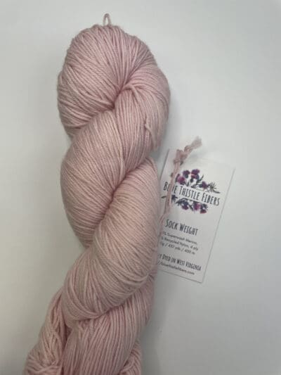 Pink Colorway: Peony. Length: 437 yds / 400 meters. 100 Grams Dark peony sock yarn is perfect for your next pink project ! Made from 75% Superwash Merino Wool and 25% Recycled Nylon, this 4-ply yarn from Peru is strong and light. Perfect for everyday garment projects. <strong>While our team hand-dyes each skein with the utmost care, natural dyes results can vary based on plant materials and fibers. Please be aware that variations in color and appearance may vary from the display image.  Please wash before using, as naturally dyed fibers can run the first few washings.</strong> US Knitting Needle US 1-2, 3.25 mm. Crochet Hook D3. Stitches per Inch: 30 st/4″ or 7-8 st/1″