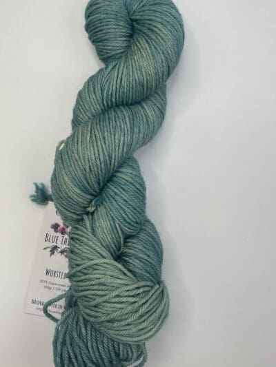 Green Colorway: Variegated Dark Sea Green. 219 yards / 200 meters. 100 grams Variegated Dark Sea Green Worsted 4-ply  yarn is certified mulesing-free SW 100% Merino wool with variegated stripes with a hint of blush rose, moss green and cream throughout. This yarn quickly works up into hats and sweaters everyone will love to wear. A durable yarn that holds up to washing and wearing. Care Instructions: Machine wash on a gentle cycle using mild detergent. Do not bleach. Dry flat away from direct sunlight. <strong>While our team hand-dyes each skein with the utmost care, natural dyes results can vary based on plant materials and fibers. Please be aware that variations in color and appearance may vary from the display image. Please wash before use, as naturally dyed yarn can bleed for the first few washings.</strong>