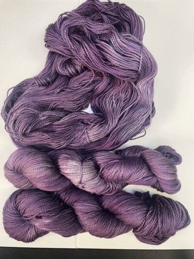 Purple Colorway: Variegated Violet. Length: 328 yds / 300 meters/100g Variegated Violet 100% Puma Cotton DK is our first VEGAN yarn base. Spun from 100% organic Pima cotton, this yarn is a soft option for warm-weather knits. At a utilitarian DK weight, this yarn is as easy to wear as it is to care for. You’ll love making tops, sweaters and baby gear with Blue Thistle 100% Pima Cotton yarn. Perfect for knitting or crocheting projects. Care Instructions: Hand wash in cold water with a gentle detergent made specifically for washing wool and other fine fibers or a PH-neutral, dye-free detergent. Lay flat to dry. Length: 437 yds / 400 meters. <strong>While our team hand-dyes each skein with the utmost care, natural dyes results can vary based on plant materials and fibers. Please be aware that variations in color and appearance may vary from the display image.  Naturally dyed yarns can blend color the first few washings, so please wash your yarn before use.</strong>