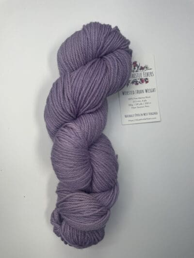 Purple Colorway: Variegated Dark Plumr Aran. Length: 219 yds. / 200 m/ 100g. Non-Superwash. Wool Country: Peru. Variegated Dark Plum Aran 21.5 mic 4-ply yarn is non-superwash naturally dyed with sustainably harvested/foraged dye material from plants, minerals, roots, trees, and other organic materials. Blue Thistle Fiber’s 4-ply Aran yarn is certified mulesing-free non-SW 100% Merino wool and quickly works up into hats and sweaters everyone will love to wear. A durable yarn that holds up to washing and wearing. Care Instructions: Machine wash on a gentle cycle using mild detergent. Do not bleach. Dry flat away from direct sunlight. &lt;strong&gt;While our team hand-dyes each skein with the utmost care, natural dyes results can vary based on plant materials and fibers. &lt;/strong&gt;&lt;strong&gt;Please wash before using, as naturally dyed fibers can run the first few washings.&lt;/strong&gt; &lt;strong&gt;Please be aware that variations in color and appearance may vary from the display image.&lt;/strong&gt; &nbsp;