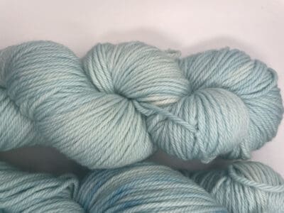 Blue Colorway: Variegated Light Hydrangea Aran. Length: 219 yds. / 200 m/ 100g. Non-Superwash. Wool Country: Peru. Variegated Light Hydrangea Aran 21.5 mic 4-ply yarn is non-superwash naturally dyed with sustainably harvested/foraged dye material from plants, minerals, roots, trees, and other organic materials. Blue Thistle Fiber’s 4-ply Aran yarn is certified mulesing-free non-SW 100% Merino wool and quickly works up into hats and sweaters everyone will love to wear. A durable yarn that holds up to washing and wearing. Care Instructions: Hand wash in cold water with a gentle detergent made specifically for washing wool and other fine fibers or a PH-neutral, dye-free detergent. Lay flat to dry. <strong>While our team hand-dyes each skein with the utmost care, natural dyes results can vary based on plant materials and fibers. </strong><strong>Please wash before using, as naturally dyed fibers can run the first few washings.</strong> <strong>Please be aware that variations in color and appearance may vary from the display image.</strong>  