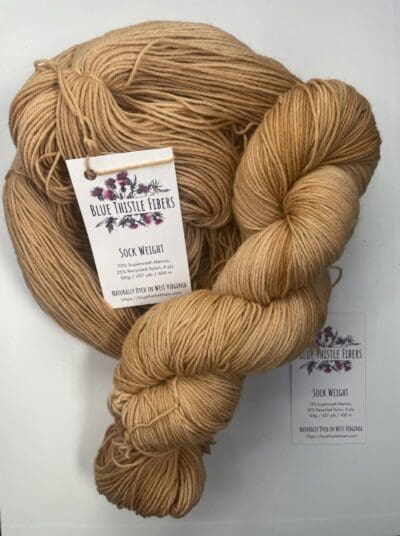 a close-up of a barley colored skein of yarn